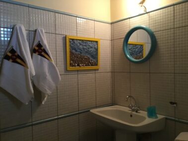 The beach and the sand landed in the bathroom